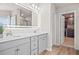 Elegant bathroom with double vanity, large mirror, and walk-in closet at 1049 Bodega Loop, Locust Grove, GA 30248