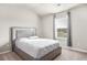 Spacious bedroom with large bed and window at 1049 Bodega Loop, Locust Grove, GA 30248