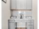 Built-in coffee bar with gray cabinets and white countertop at 1049 Bodega Loop, Locust Grove, GA 30248