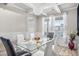 Bright dining room with glass table and white chairs at 1049 Bodega Loop, Locust Grove, GA 30248