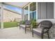 Front porch with three wicker chairs and plants at 1049 Bodega Loop, Locust Grove, GA 30248