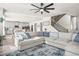 Spacious living area with sectional sofa and view into kitchen at 1049 Bodega Loop, Locust Grove, GA 30248