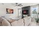 Cozy living room with sectional sofa and a modern fireplace at 1049 Bodega Loop, Locust Grove, GA 30248