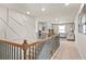 Spacious loft area with neutral color palette and stylish geometric wall design at 1049 Bodega Loop, Locust Grove, GA 30248