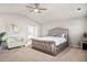 Relaxing main bedroom with plush upholstered bed and soothing decor at 1049 Bodega Loop, Locust Grove, GA 30248