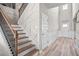 Modern staircase with wood steps and metal railing at 1049 Bodega Loop, Locust Grove, GA 30248