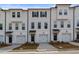 Front view of townhome community with attached garages at 3216 Bateman Se Dr, Atlanta, GA 30354