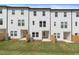 Row of townhouses with private backyards and wooden fences at 3218 Bateman Se Dr, Atlanta, GA 30354