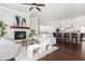 Living room with fireplace, hardwood floors, and open concept kitchen at 765 Belle Isle Dr, Alpharetta, GA 30009