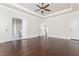 Main bedroom with hardwood floors, multiple doors and access to other rooms at 765 Belle Isle Dr, Alpharetta, GA 30009