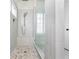 Large walk-in shower with pebble floor and multiple shower heads at 765 Belle Isle Dr, Alpharetta, GA 30009