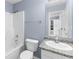 Small bathroom with a shower/tub combo and granite countertop vanity at 2459 Wall Se St, Conyers, GA 30013