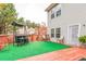 Deck with artificial turf, seating, and a bar area at 3210 Avondale Pkwy, Powder Springs, GA 30127