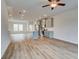 Open concept living room with hardwood floors and kitchen view at 3220 Bateman Se Dr, Atlanta, GA 30354