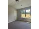 Bright bedroom featuring a large window and closet at 3056 Zodiac Ct, Lawrenceville, GA 30044