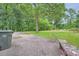 Large backyard with patio and mature trees at 2413 Kennesaw Due West Nw Rd, Kennesaw, GA 30152