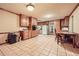 Eat-in kitchen with oak cabinets and tile floors at 2413 Kennesaw Due West Nw Rd, Kennesaw, GA 30152