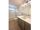 Modern bathroom with gray vanity, white countertop, and a bathtub shower combo at 3046 Zodiac Ct, Lawrenceville, GA 30044