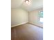 Spacious bedroom with carpeted floor and a window with natural light at 3046 Zodiac Ct, Lawrenceville, GA 30044