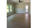 Spacious Gathering room with light-colored LVP flooring and backyard access at 3046 Zodiac Ct, Lawrenceville, GA 30044