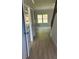 Bright hallway with LVP flooring and access to other rooms at 3046 Zodiac Ct, Lawrenceville, GA 30044