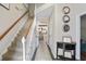 Bright entryway with staircase, tile flooring, and a console table at 76 Barrington Parkway Pkwy, Sharpsburg, GA 30277