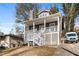 Two-story home with front porch and landscaping at 1477 Akridge Nw St, Atlanta, GA 30314