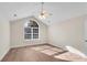 Bedroom with vaulted ceiling, large window, and wood-look flooring at 4022 Vineyards Ln, Kennesaw, GA 30144