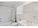 Clean bathroom with a shower/tub combo and white vanity at 1035 Eagles Brooke Dr, Locust Grove, GA 30248