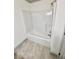 Clean bathroom with tub shower and gray tile flooring at 1265 Watercrest Cir, Lawrenceville, GA 30043