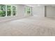 Finished basement with grey carpet and lots of natural light at 469 Maypop Ln, Woodstock, GA 30188