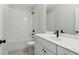 Modern bathroom with white subway tile, white vanity, and black fixtures at 469 Maypop Ln, Woodstock, GA 30188