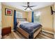 Bright bedroom with a queen-size bed and blue curtains at 660 Simmons Nw St, Atlanta, GA 30318