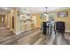 Modern dining area with glass table, chairs, and kitchen access at 660 Simmons Nw St, Atlanta, GA 30318