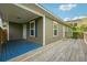 Inviting front porch with blue painted floor and wooden deck at 660 Simmons Nw St, Atlanta, GA 30318