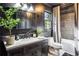 Bathroom with dark walls, white vanity, and bathtub at 1445 Sheridan Ne Walk, Atlanta, GA 30324