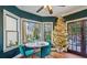 Charming breakfast nook with teal accents and a Christmas tree at 1445 Sheridan Ne Walk, Atlanta, GA 30324