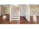 Wood staircase with white risers in a hardwood hallway at 197 Bolling Rd, Atlanta, GA 30305