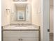 Bathroom with a granite vanity, mirror, and light fixture at 896 Meadow Rock Way, Stone Mountain, GA 30083