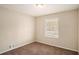 Vacant bedroom featuring carpeted flooring and natural light from a window at 896 Meadow Rock Way, Stone Mountain, GA 30083
