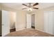 Spacious bedroom with carpet, ceiling fan, closet, and ensuite bathroom at 896 Meadow Rock Way, Stone Mountain, GA 30083