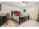 Guest bedroom with a dark wood bed frame at 2646 Oak Barrel Dr, Snellville, GA 30078