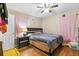 Spacious bedroom with hardwood floors and ceiling fan at 5932 Gresham Sw Pl, Mableton, GA 30126