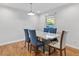 Bright dining room with a large table and blue chairs at 5932 Gresham Sw Pl, Mableton, GA 30126