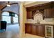 Elegant basement bar with wine storage and granite countertop at 595 S Mount Carmel Rd, Mcdonough, GA 30253