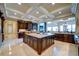Spacious kitchen boasts large island, custom cabinetry, and breakfast bar at 595 S Mount Carmel Rd, Mcdonough, GA 30253