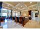 Gourmet kitchen features island, high-end appliances, stone accents, and coffered ceiling at 595 S Mount Carmel Rd, Mcdonough, GA 30253