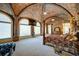 Luxurious main bedroom with vaulted ceiling, large windows and sitting area at 595 S Mount Carmel Rd, Mcdonough, GA 30253