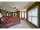 Luxurious main bedroom with bay windows and a comfy sitting area at 595 S Mount Carmel Rd, Mcdonough, GA 30253
