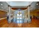 Grand upper landing with a stunning chandelier and hardwood floors at 595 S Mount Carmel Rd, Mcdonough, GA 30253